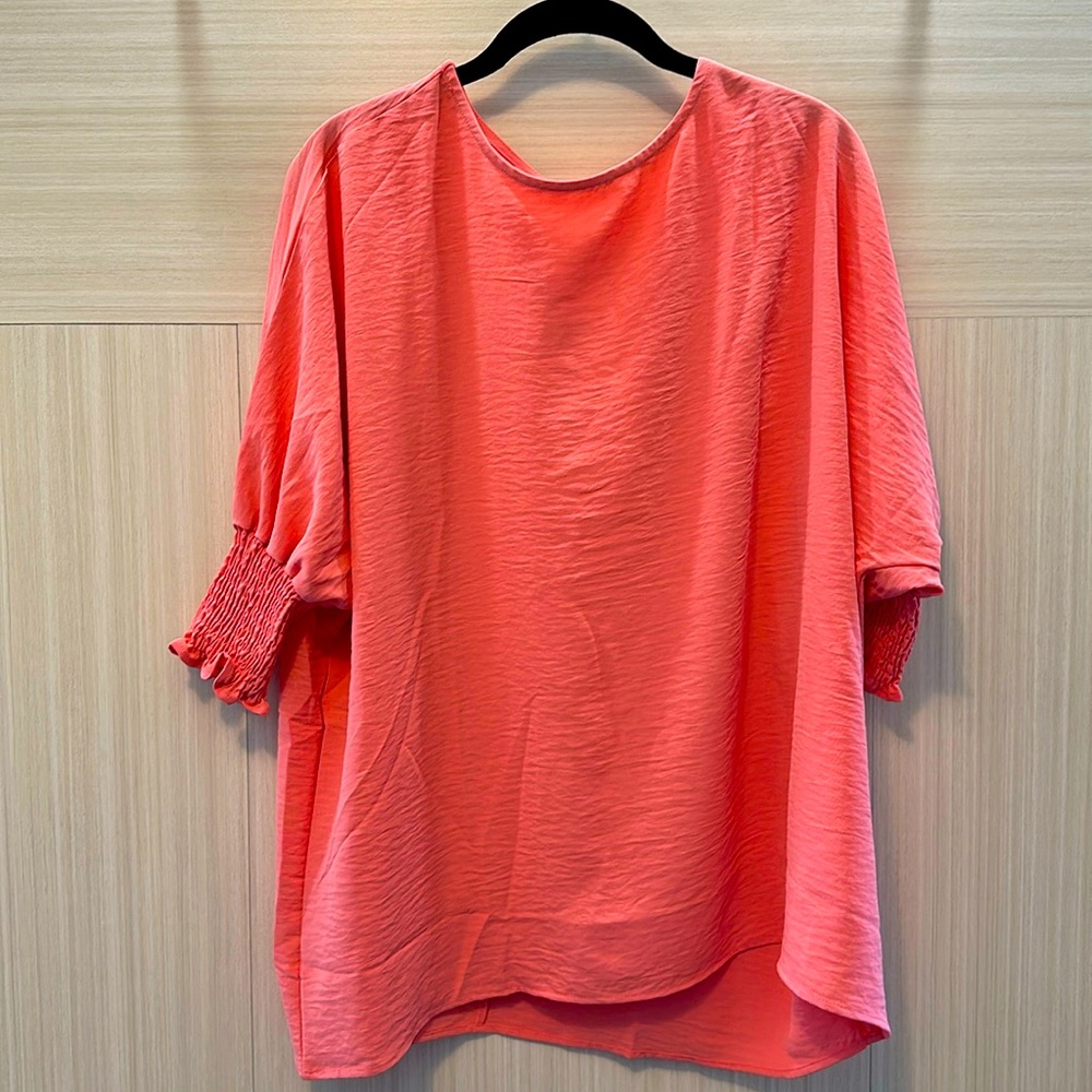 Peach Tunic with rouched sleeve detail!